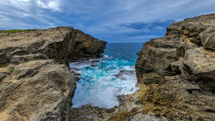 Fototapeta na wymiar The Waves At The Cliffs of Cueva del Indio Puerto Rico