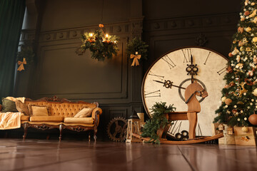 Stylish room interior with Christmas tree, big vintage clock and festive decor
