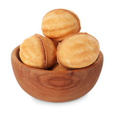 Bowl of delicious nut shaped cookies with condensed milk on white background