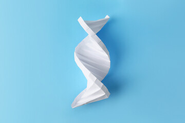 DNA molecule model made of white paper on light blue background, top view - obrazy, fototapety, plakaty