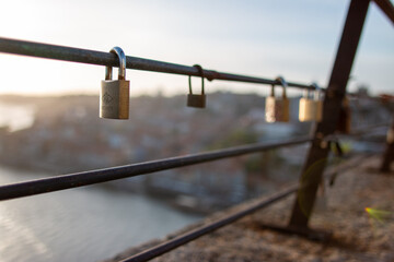 Locks attached to railing overlooking porto a sign of love 