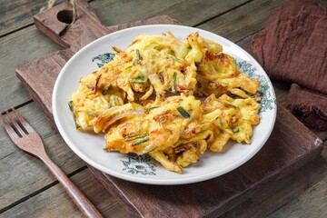 Vegetable Fritters. Malaysian called Cucur Sayur or Cekodok Sayur. Indonesian called Bakwan Sayur. Served with chili sauce. A popular snack in  Southeast Asia.