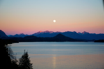 landscape of full moon in a morning in the lake in patagonia