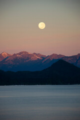 landscape of full moon in a morning in the lake in patagonia
