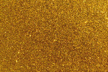 Golden glitter texture background. Photo can be used for the concept of New Year, Christmas and all celebrations backgrounds.