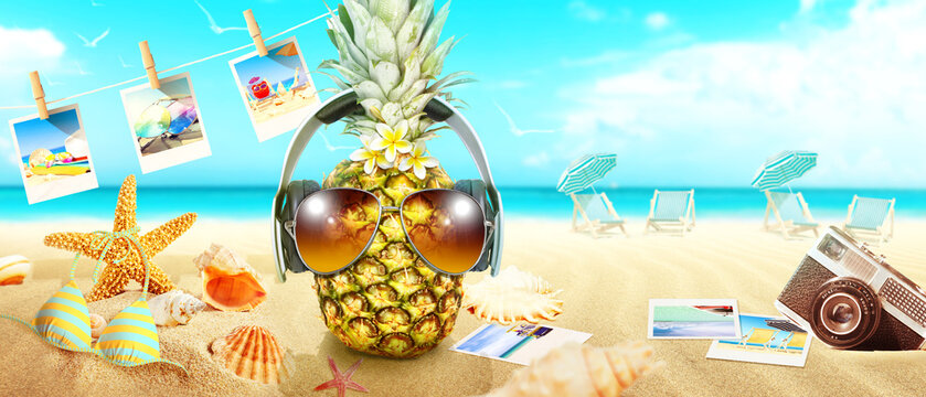 Creative pineapple with sunglasses on summer background.