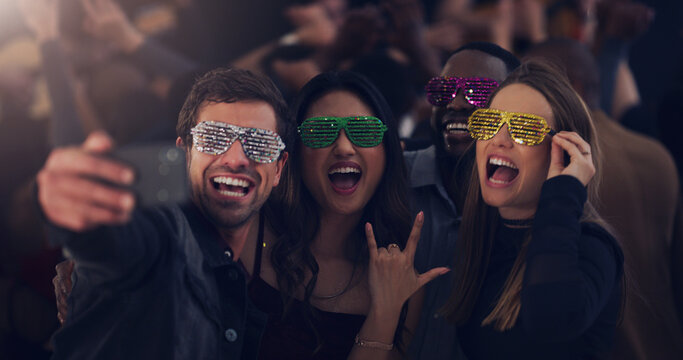 Selfie, sunglasses and friends at party for celebration, festival and dance at social event. Night club, disco and happy men and women take picture for memories, post and celebrate new years eve