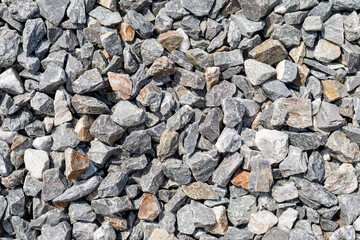 A floor full of gravel stones. sunlight