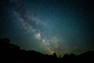 Fototapeta na wymiar Dark sky full of stars with the Milky Way. Carpathian Mountains, Poland.
