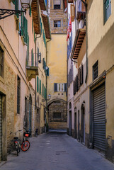 Fototapeta na wymiar Gothic buildings on a narrow street in Centro Storico of Florence, Italy