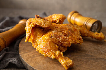Fried chicken on a wooden cutting board