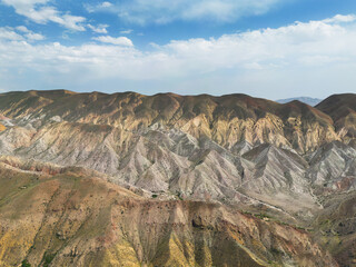 Aerial view mountain over blue sky. Drone view mountain valley. Beautiful view from above surface of mountain hills.
