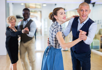 Adult dancing couple enjoying active swing