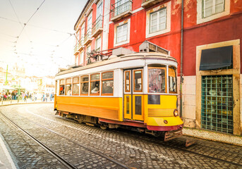 Plakat tram on narrow street of Alfama, Lisbon
