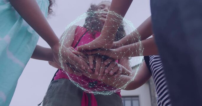 Animation of globe with connections over diverse children stacking hands