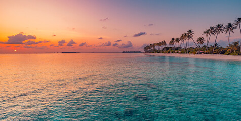 Beautiful panoramic sunset sea sky tropical paradise beach. Tranquil summer vacation travel landscape. Peaceful seaside palm calm panorama. Exotic nature view inspire seascape. Best Maldives wallpaper - obrazy, fototapety, plakaty