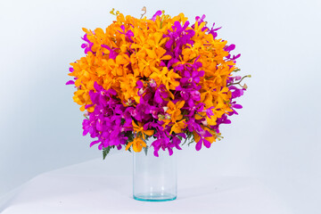 Many kinds of flowers put it in a vase on a white background