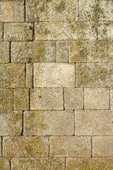 detail of a rectangular granite masonry wall, textured background