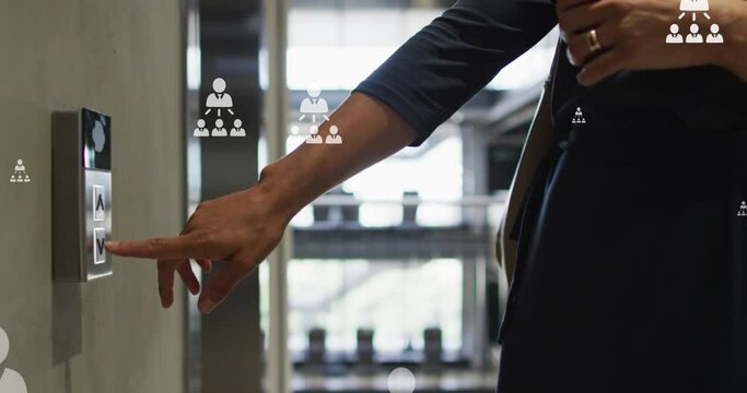 Imation of multiple profile icons floating against mid section of a woman pressing elevator button