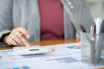 Business Woman working by using laptop computer Hands typing on a keyboard. Professional investor working new start up project. business planning in office. Technology business Concept.