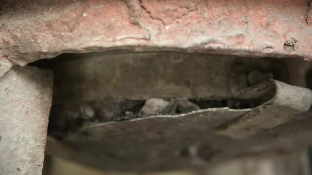 Close-Up of Burning Coal Charcoal Hot Coals inside Metal Furnace Grill Stove
