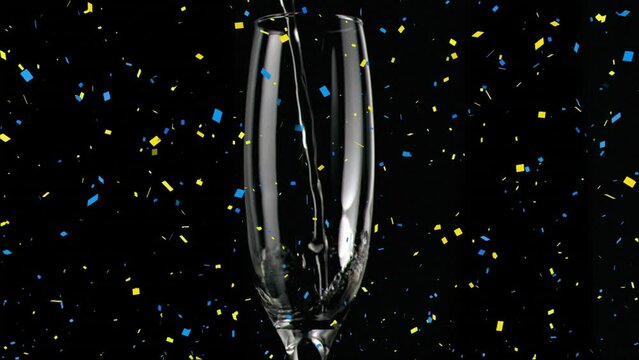 Animation of falling confetti over champagne getting poured in flute glass against black background