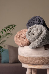 Basket with a rolled pastel colors terry towels