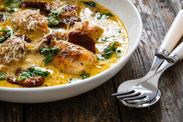 Creamy Tuscan chicken with parmesan, spinach and sun dried tomatoes.