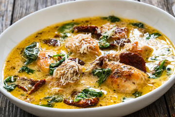 Creamy Tuscan chicken with parmesan, spinach and sun dried tomatoes.