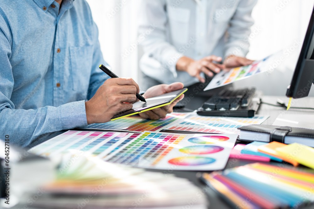 Aufkleber Team of creative graphic designer working on color swatch samples chart for selection coloring in inspiration to create new collection at workplace
