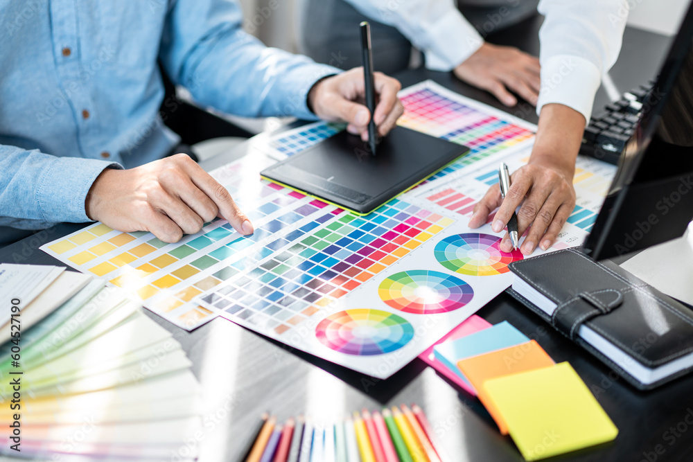 Aufkleber Team of creative graphic designer working on color swatch samples chart for selection coloring in inspiration to create new collection at workplace