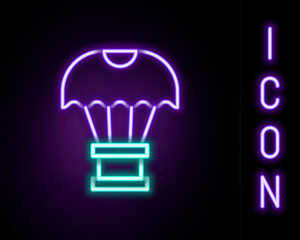 Glowing neon line Box flying on parachute icon isolated on black background. Parcel with parachute for shipping. Delivery service, air shipping. Colorful outline concept. Vector