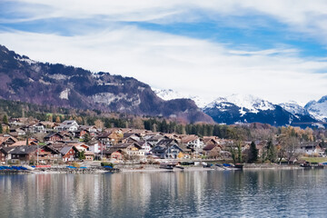 A view of a town with mountains in the background