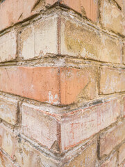 Corner of a brick wall of a house, close-up.