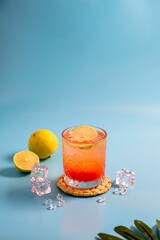A mocktail made with lemon, soda, and a few other ingredients looks very fresh.