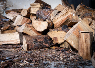 Pile of pine heap  firewoods in a stack. Nutural  wood for winter fuel at home