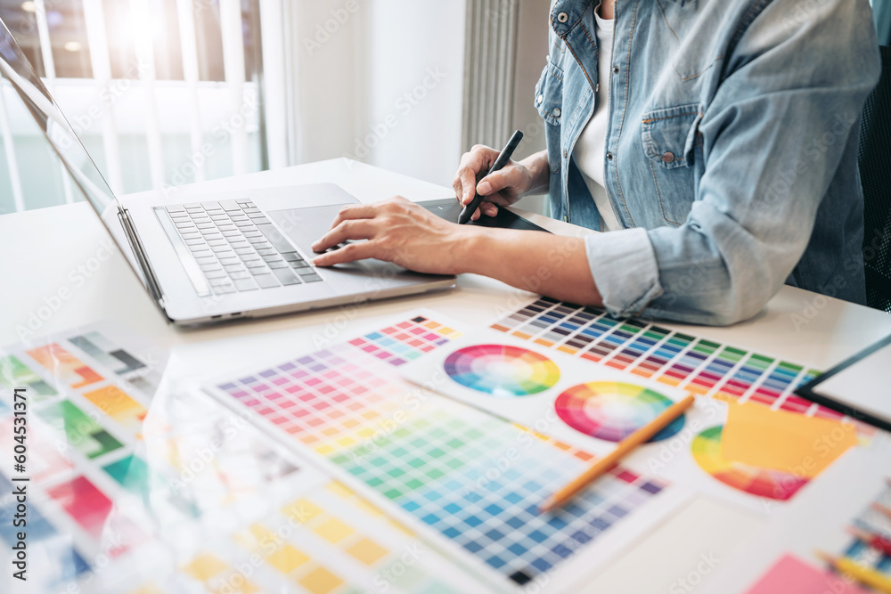 Poster young creative graphic designer working on color selection and d