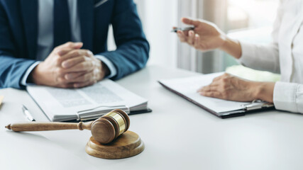 Male lawyer is pointing on legal document to explaining about co
