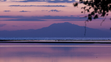 Beautiful purple sunset sky and ocean with tropical island of Atauro in Timor-Leste, Southeast Asia
