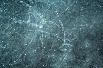 Close-up view of cracked ice on a pond