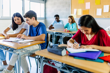 Young group of diverse students studying in classroom at high school. Education lifestyle concept.