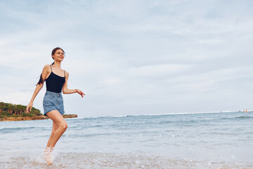 woman sea running lifestyle travel fun smile young summer sunset beach