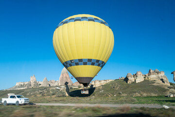 The hot air balloons flying above Goreme park, Sunrise time, Cappadocia, Turkey