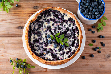 Traditional homemade blueberry pie on wooden table, top view