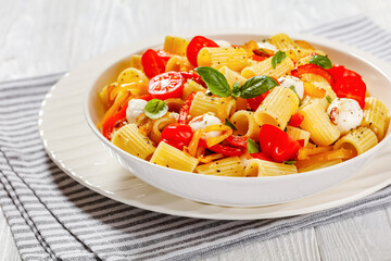 pepper tomato mozzarella pasta salad in bowl