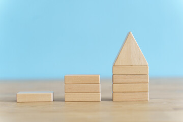 Growth, target, upskill concept. Growth of wooden cubes on a clean background. Business, economics, strategy idea