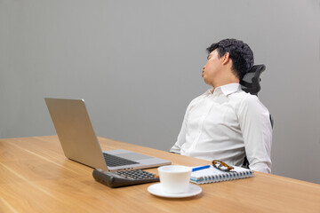 Man with narcolepsy is fall asleep on office desk..Narcolepsy is a sleep disorder that makes people...