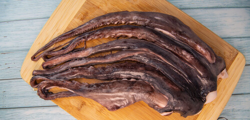 Whole fresh raw octopus on cutting board, High quality photo