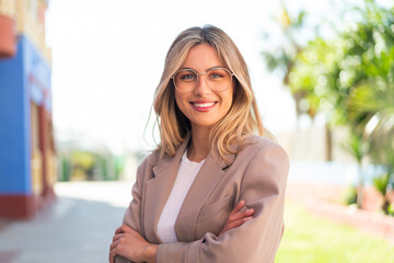 Pretty blonde Uruguayan woman With glasses with happy expression