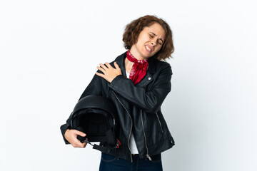 English woman holding a motorcycle helmet isolated on white background suffering from pain in shoulder for having made an effort